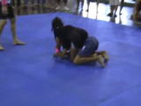 Young girl chokes man in BJJ competition